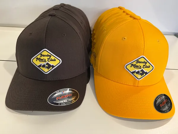 Brown and gold caps, stacked, each with a Jacoby Men's Club diamond patch